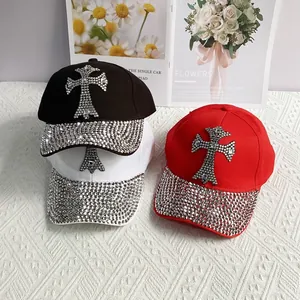 Close-up of rhinestone cross baseball caps in black, white and red colors