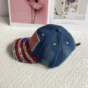 Detail of denim baseball cap featuring American flag pattern in red and silver rhinestones