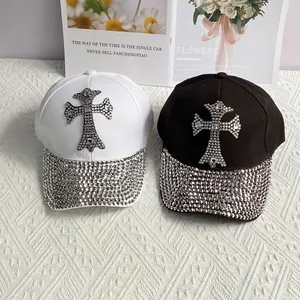 Set of black and white baseball caps with rhinestone cross patches and sparkling brims