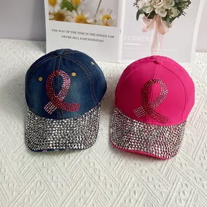 Denim baseball caps with rhinestone pink ribbon emblem and fully studded crystal brims
