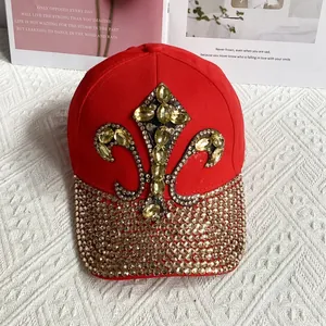 Detail of red denim baseball cap with gold rhinestones and iris flower emblem