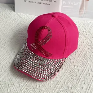 Detail view of hot pink denim baseball cap featuring rhinestones and pink ribbon pattern