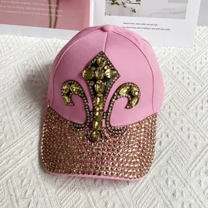 Detail of pink denim baseball cap with gold fleur-de-lis crystal and diamond brim