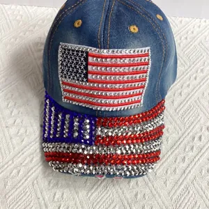 Detail view of denim baseball cap with American flag patch and shiny rhinestone crystals