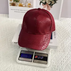 Detail shot showing the 95g lightweight red crocodile pattern faux leather baseball cap