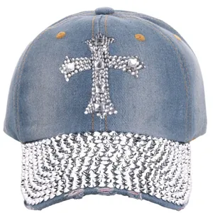 Detail of light blue denim baseball cap with rhinestone cross and studded brim