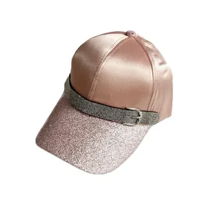 Women's rose gold satin baseball cap with glitter brim and rhinestone buckle detail
