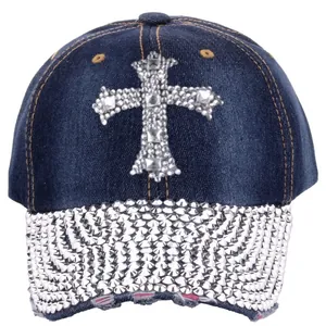 Detail of silver rhinestones cross and studded spikes on navy denim baseball cap