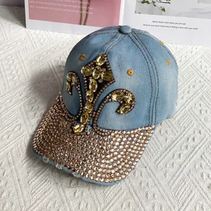 Detailed macro view of denim baseball cap with yellow gem flower and rhinestone brim