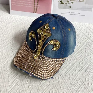 Close-up of denim baseball cap with iris floral pattern and champagne rhinestones