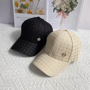 Houndstooth baseball cap with diamond M logo in black and beige color options