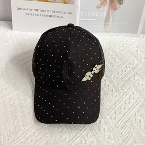 Detail of leaf-shaped rhinestone ornament on luxury breathable black baseball cap