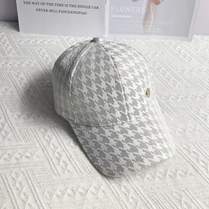 Detailed macro view of the light grey houndstooth pattern and breathable mesh texture
