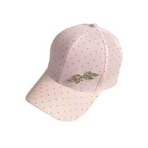 Pink baseball cap with leaf rhinestones and gold leaf metal accessory on white background
