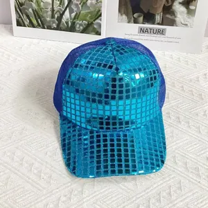 Detailed close-up of blue sequin baseball cap with reflective plaid pattern and mesh back