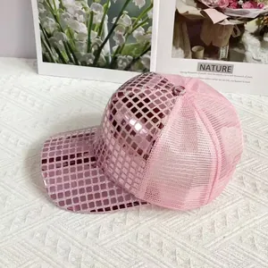 Detail of pink disco sequin baseball cap showing reflective mirror tiles and mesh back