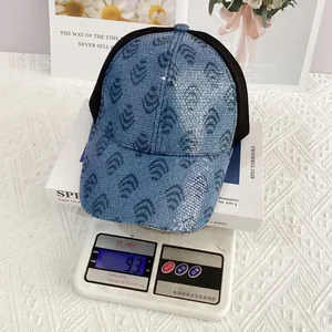 Detail of blue sequin baseball cap with leopard pattern and breathable black mesh