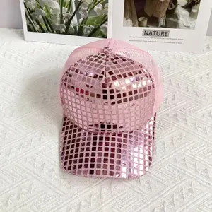 Macro detail of pink sequins and breathable mesh on a stylish laser reflective baseball cap