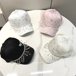 Fashionable baseball caps with rhinestone tassels, jacquard fabric and butterfly details