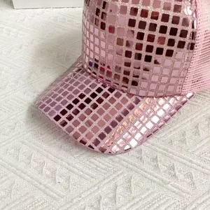 Detail of pink mirror sequins and square reflective scales on the stylish mesh baseball cap
