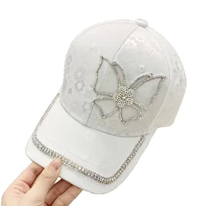 White baseball cap with rhinestone butterfly and floral jacquard texture for women