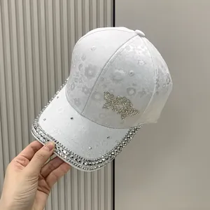 White floral jacquard baseball cap with rhinestone butterfly and crystal brim for women
