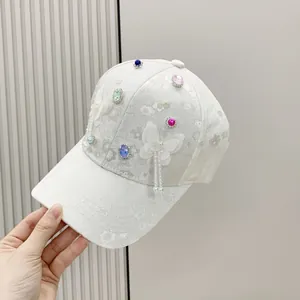 White jacquard baseball cap with colorful rhinestones and 3D butterfly ornaments