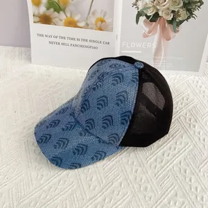 Detailed view of blue sequins with scallop pattern and breathable mesh on baseball cap