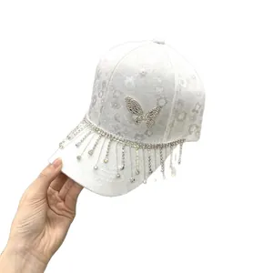 Fashionable white lace baseball cap with rhinestone butterfly and tassel fringe decor