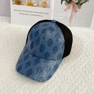 Detail of blue sequined baseball cap with leopard geometric pattern and mesh back