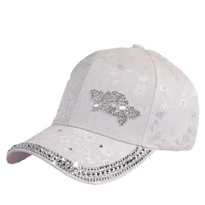 Elegant white lace baseball cap with floral embroidery and sparkling rhinestone butterfly