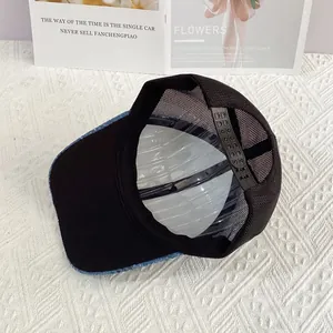 Detail view of the breathable mesh back and adjustable snapback closure on a baseball cap