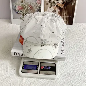 Lightweight white newsboy cap featuring sequin embroidery on mesh, weighing only 76g