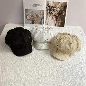 Close-up of sequined star and moon embroidery on breathable mesh newsboy hats