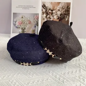 Chic women's beret with rhinestone butterfly buckle and subtle starry glitter accents