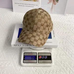 Detailed view showing the 94g lightweight rhinestone ZD jacquard baseball cap on a scale