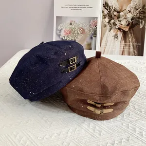 British style beret with leather buckle detail in navy blue and caramel brown colors