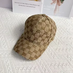 Macro shot of khaki baseball cap with ZD monogram patterns and sparkling rhinestones
