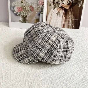 Detailed view of British plaid newsboy hat featuring sparkling rhinestone embellishments
