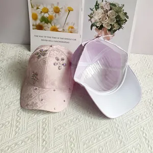 Pink lace baseball cap for women with floral rhinestones and sequins in lifestyle setting
