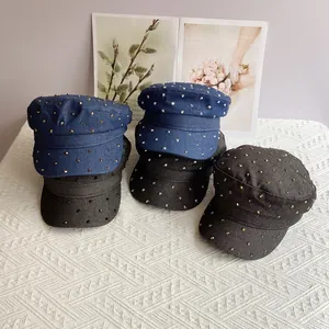 Flat top denim newsboy hats with sparkling metal studs displayed in various colors