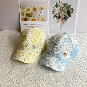Sweet sequined baseball cap with bow ornament in yellow and blue colors