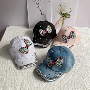 Sparkling denim baseball caps with rhinestone bows in black, white, pink and blue