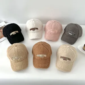 Detail of plush baseball caps showing Sherpa fleece texture and PROMOTION embroidery