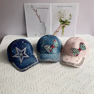 Denim baseball caps with rhinestone bows and stars in blue and pink denim options