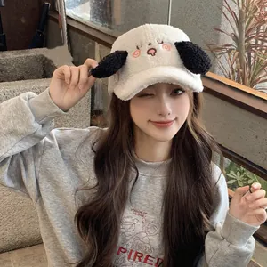 Detail of white sherpa baseball cap with embroidered puppy face and black 3D plush ears