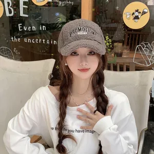 Close-up of PROMOTION embroidery on plush faux shearling winter baseball cap