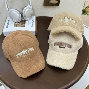 Three plush sherpa baseball caps in earth tones with PROMOTION letter embroidery