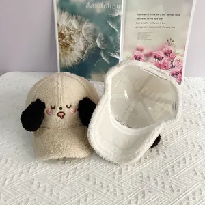 Detail of embroidered puppy baseball cap in sherpa fleece with plush ears and inner label