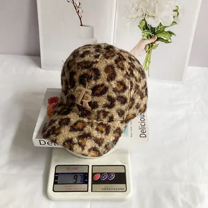 Detailed view of leopard print teddy fleece baseball cap showing a light 97g weight